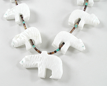 31 inch necklace with olive shell heishi and 15 white alabaster bears