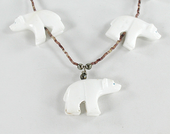 24 inch necklace with Olive Shell heishi and 7 white alabaster bears