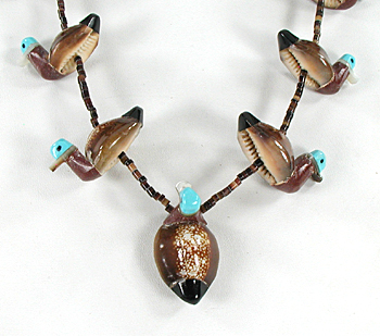 27 1/2 inch cowrie shell ducks and olive shell heishi necklace by Navajo artisan Maybelle Kelewood