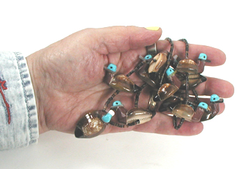27 1/2 inch cowrie shell ducks and olive shell heishi necklace by Navajo artisan Maybelle Kelewood