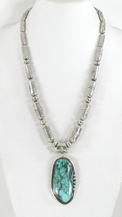 Graduated Stamped sterling silver barrel bead necklace 26 inches long with turquoise pendant