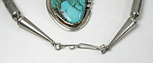 Graduated Stamped sterling silver barrel bead necklace 26 inches long with turquoise pendant