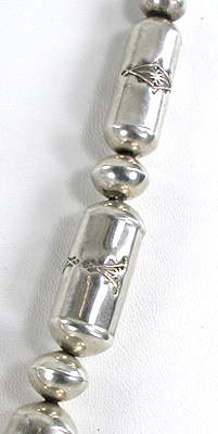 Graduated Stamped sterling silver barrel bead necklace 26 inches long with turquoise pendant