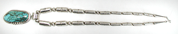 Graduated Stamped sterling silver barrel bead necklace 26 inches long with turquoise pendant