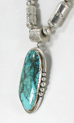 Graduated Stamped sterling silver barrel bead necklace 26 inches long with turquoise pendant