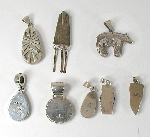 Eight vintage Sterling Silver and stone inlay pendants