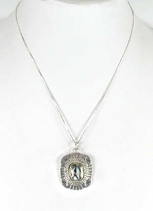 Authentic Native American sterling silver Petrified Wood Pendant by Navajo silversmith Marcella James