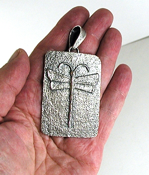 Authentic Native American Sterling Silver Dragonfly pendant by Navajo silversmith Monty Claw - side view