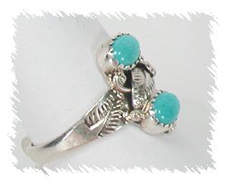 Navajo turquoise ring with two clear stones