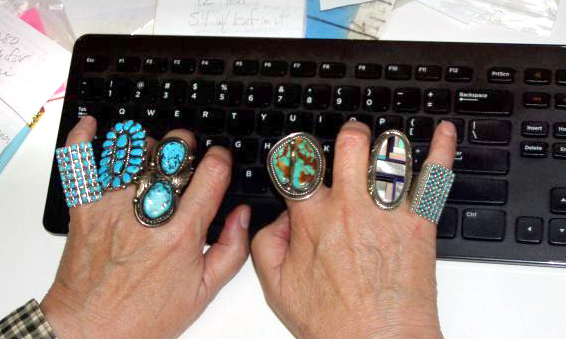 Native American sterling silver and turquoise rings displayed on keyboard