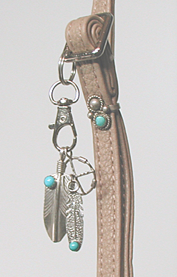 tan PU leather crossbody phone bag with sterling silver Yei and ebellishments and tassel zipper pull